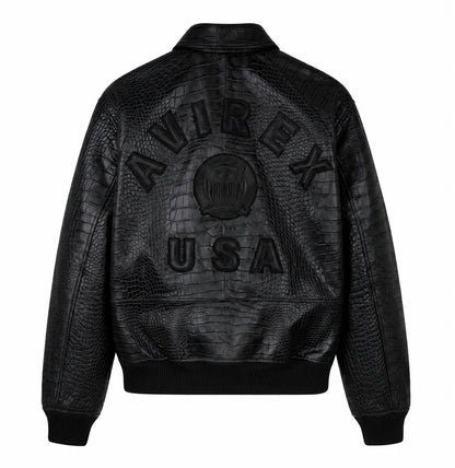Black Avirex crocodile-pattern leather jacket back view with embossed AVIREX USA branding on a clean white background.