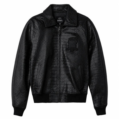 Black Avirex crocodile-texture leather jacket front view with zip closure, embroidered chest emblem and ribbed bomber cuffs on a white background.