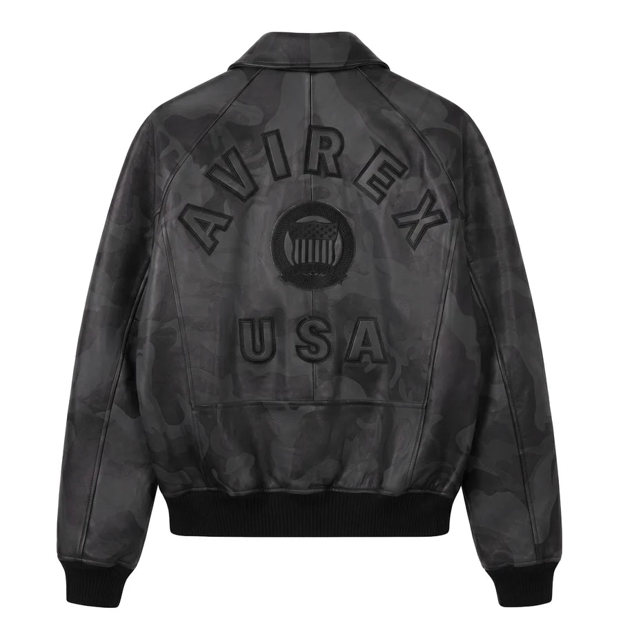 AVIREX dark camo leather jacket flat back product photo featuring AVIREX USA branding, camouflage texture, and classic bomber silhouette on a white background.
