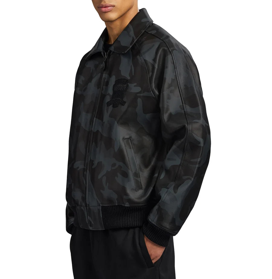 AVIREX black camouflage leather bomber jacket side view featuring a dark camo pattern, zip closure, ribbed cuffs, and modern streetwear design.