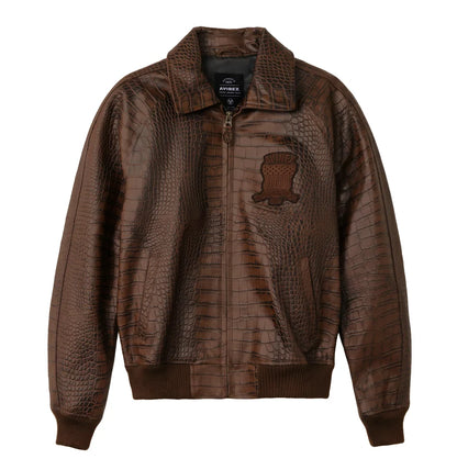 Front view of a brown crocodile-embossed bomber jacket on a white background, featuring a front zipper, textured finish, chest patch, shirt-style collar and ribbed cuffs.