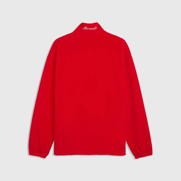 A bright red long-sleeve quarter-zip pullover jacket shown from the back, featuring a small white script logo on the inside neck collar, set against a light gray background.