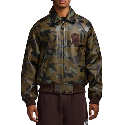 AVIREX camouflage leather bomber jacket front view on male model with olive green military print, embroidered chest patch and full zip closure