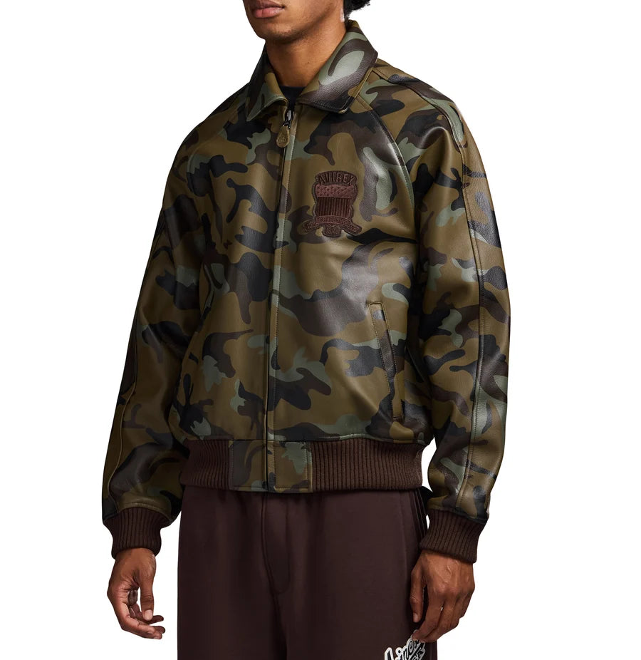AVIREX men's camouflage leather bomber jacket side view featuring olive green camo print, zip closure, ribbed cuffs and embroidered chest logo