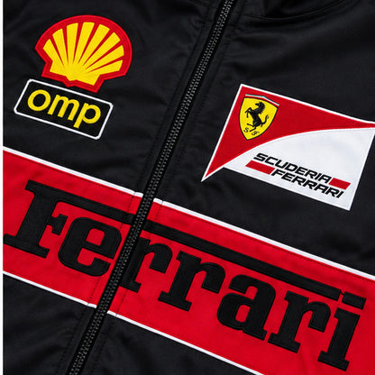 Close-up of black Ferrari-inspired racing jacket showing red stripe zipper and motorsport patches