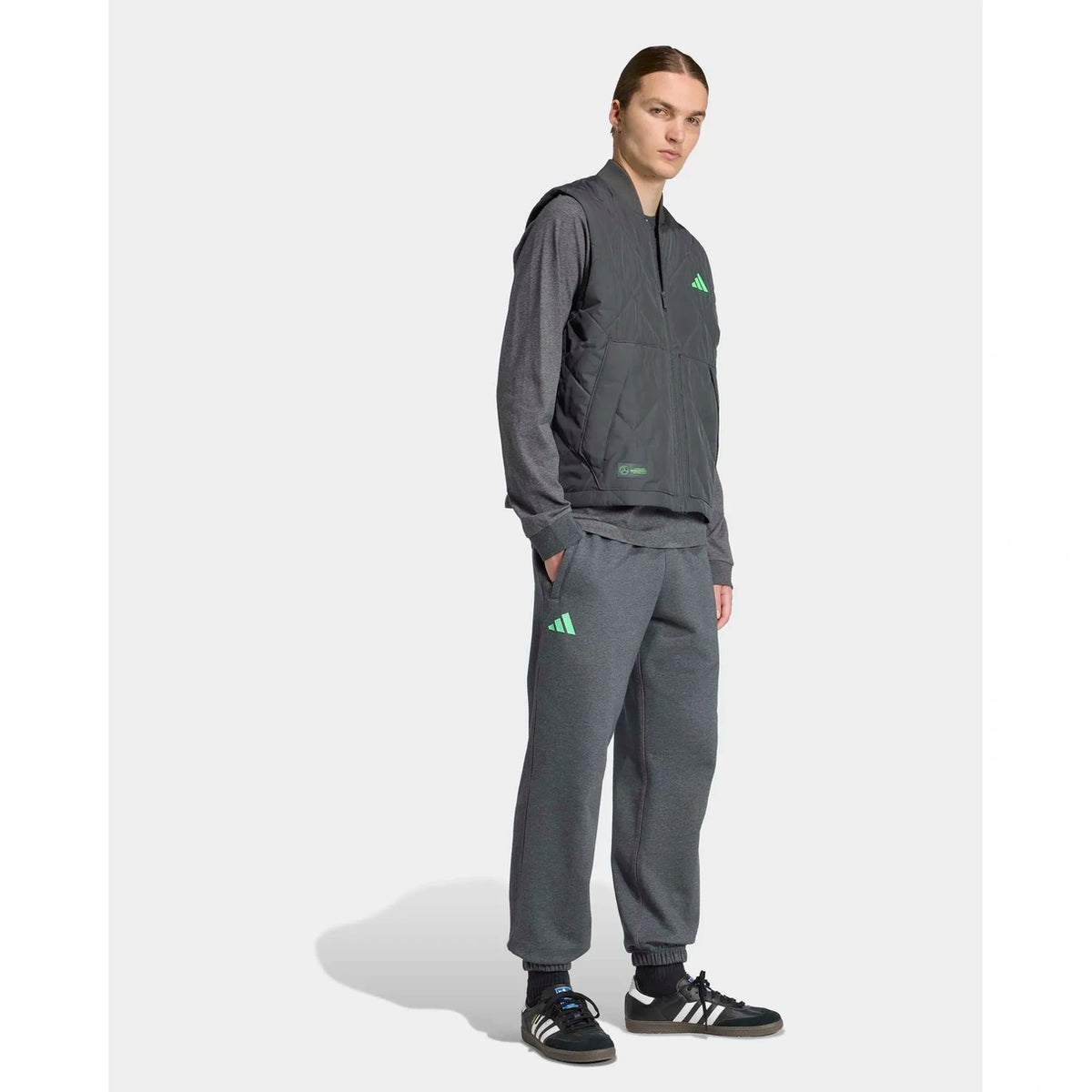 Men's grey premium sweat vest worn with matching motorsport-style outfit