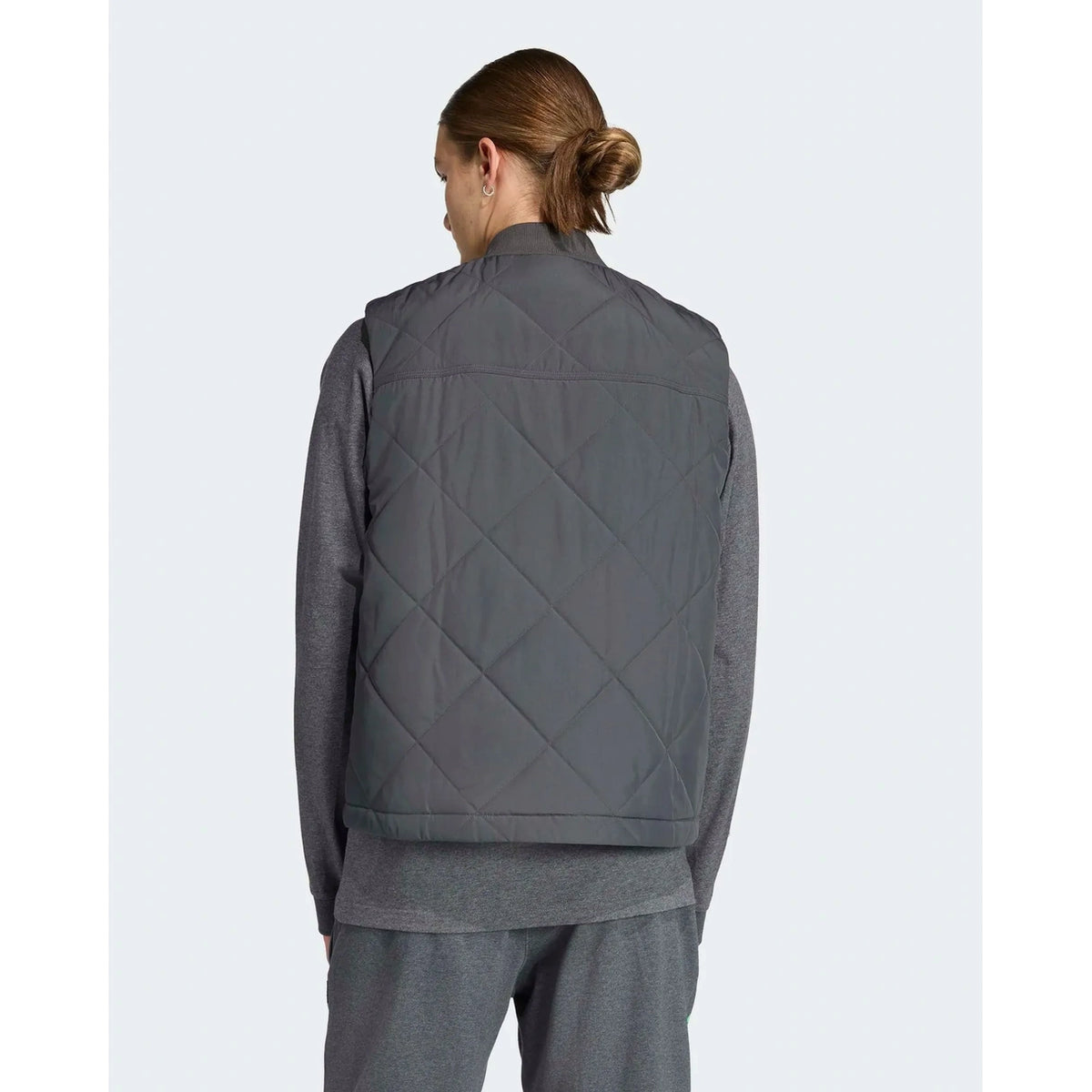 Back view of men's grey premium sweat vest showing quilted rear panel