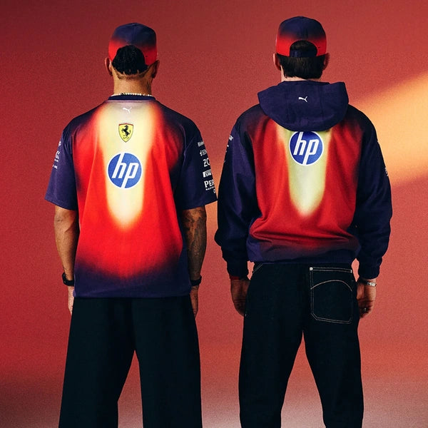 Two people wearing matching outfits with HP logos on a red background