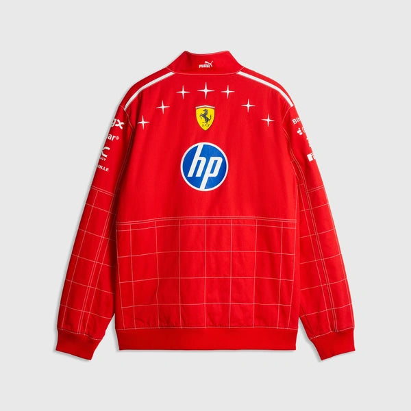 A red Scuderia Ferrari Puma jacket featuring the HP logo on the back, with white grid lines, star accents, and team branding on a light gray background.