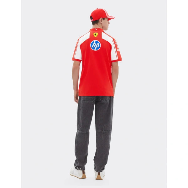 Person wearing a red Ferrari polo shirt with a blue logo on a white background