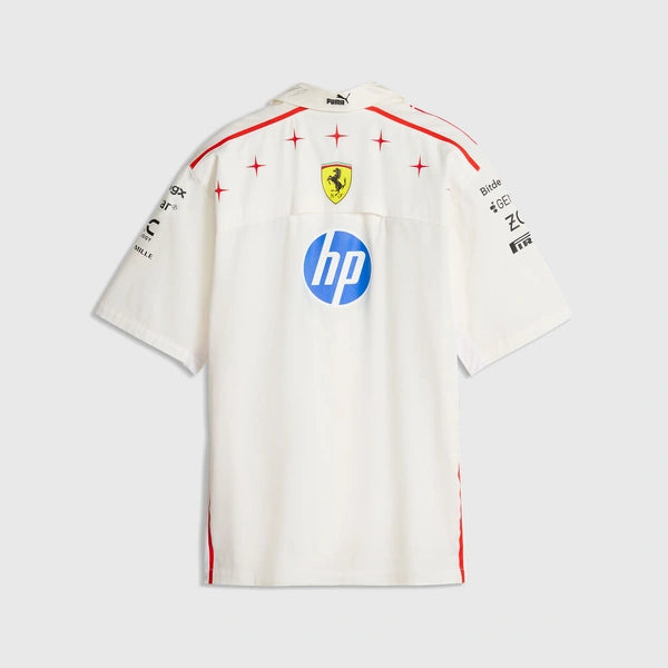 A white short-sleeve Scuderia Ferrari T-shirt shown from the back, featuring red star accents, the yellow Ferrari prancing horse crest, a blue HP logo, and black sponsor logos on the shoulders, against a light gray background.