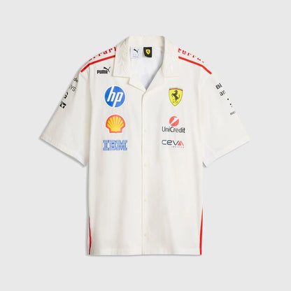 A white short-sleeve button-up shirt with Scuderia Ferrari branding, featuring sponsor logos including HP, Shell, and IBM, and the Scuderia Ferrari Ferrari shield on the chest.