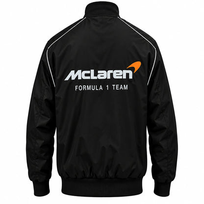 Black McLaren F1 racing jacket side view with motorsport patches, Formula 1 graphics and ribbed cuffs