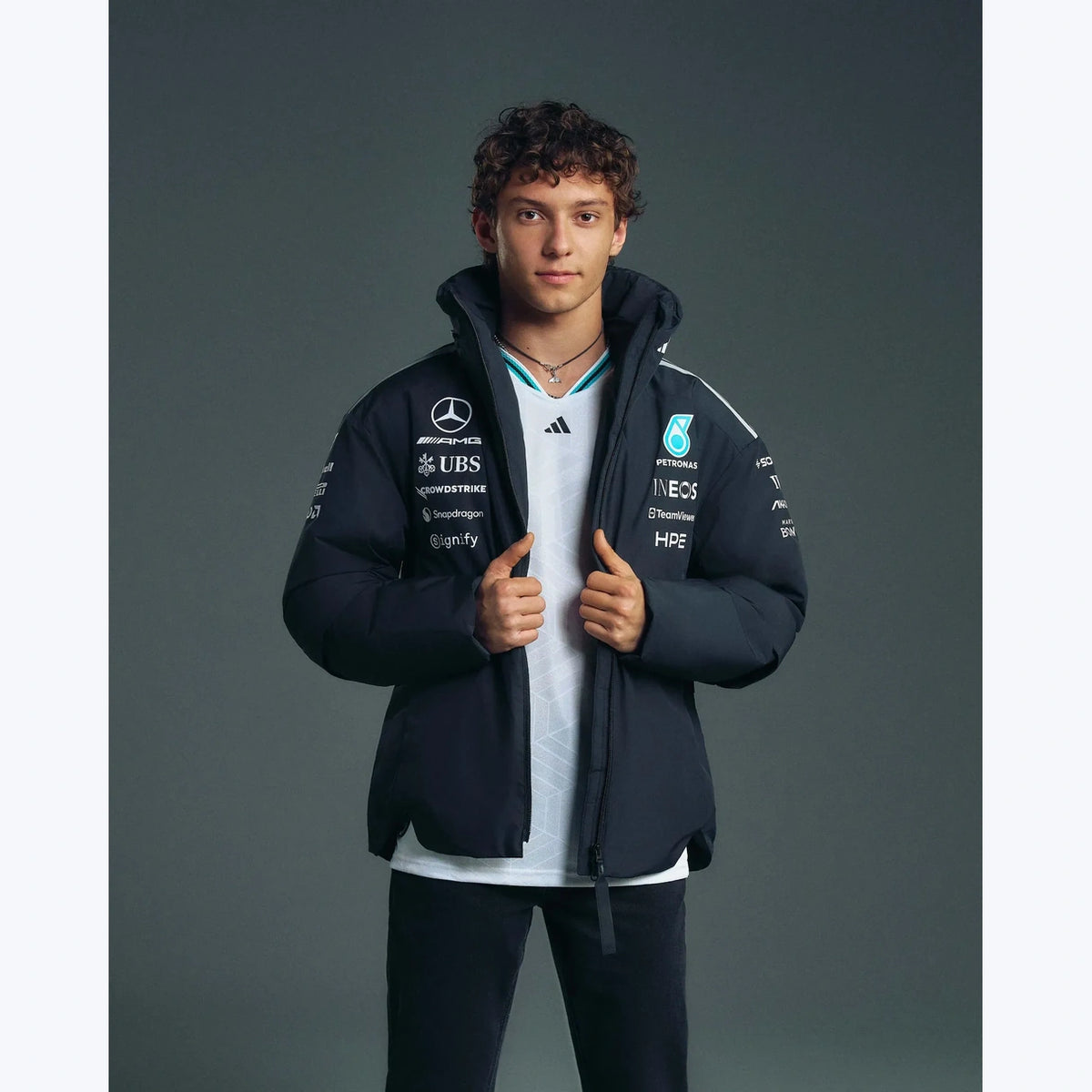 Mercedes F1 2026 black team jacket close-up showing detailed collar zipper and motorsport graphics