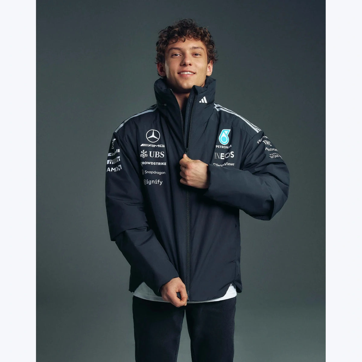 Mercedes AMG Petronas F1 2026 team jacket black lifestyle view with premium racing-inspired styling