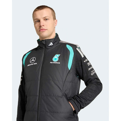 Mercedes AMG Petronas F1 vest close-up showing high neck, teal accents and racing details