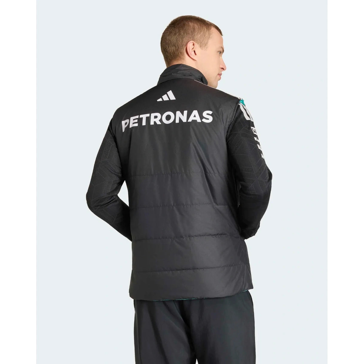 Mercedes F1 mechanics vest back view showing motorsport graphics and branding